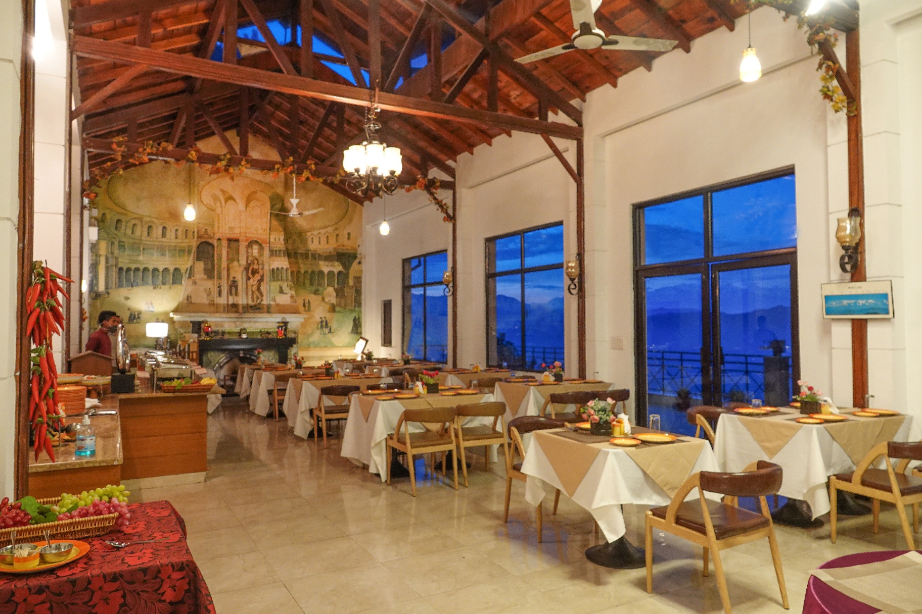 Woodsvilla restaurant evening ambiance with mountain views