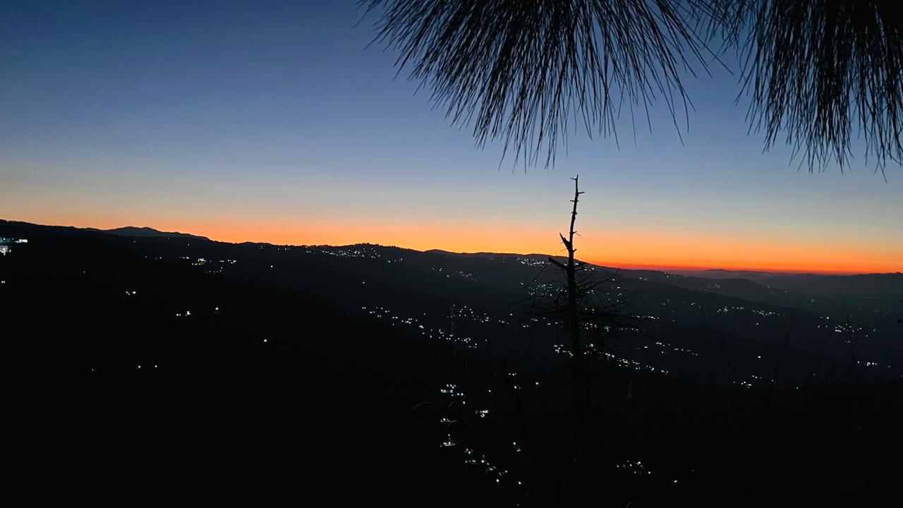 Twilight with village lights below